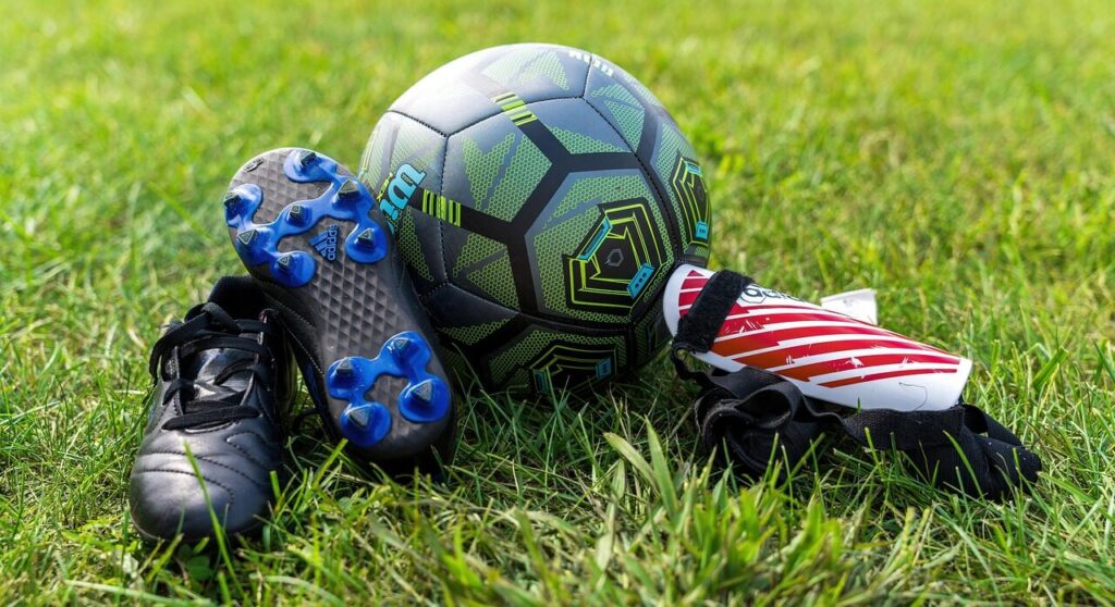 soccer, gear, ball, soccer shoes, soccer ball, soccer gear, sport, equipment, cleats, shin guards, protection, nature, sports, grass, hobby, recreational activity